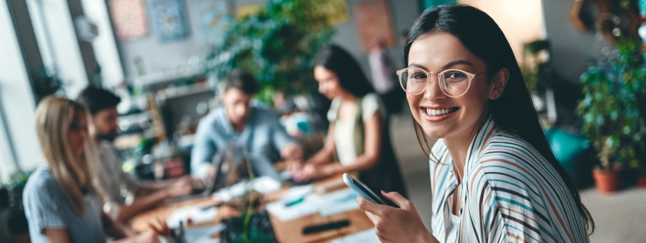 Image of a smiling girl with cell phone
