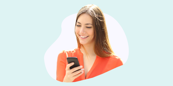 Image of a woman receiving a text and smiling